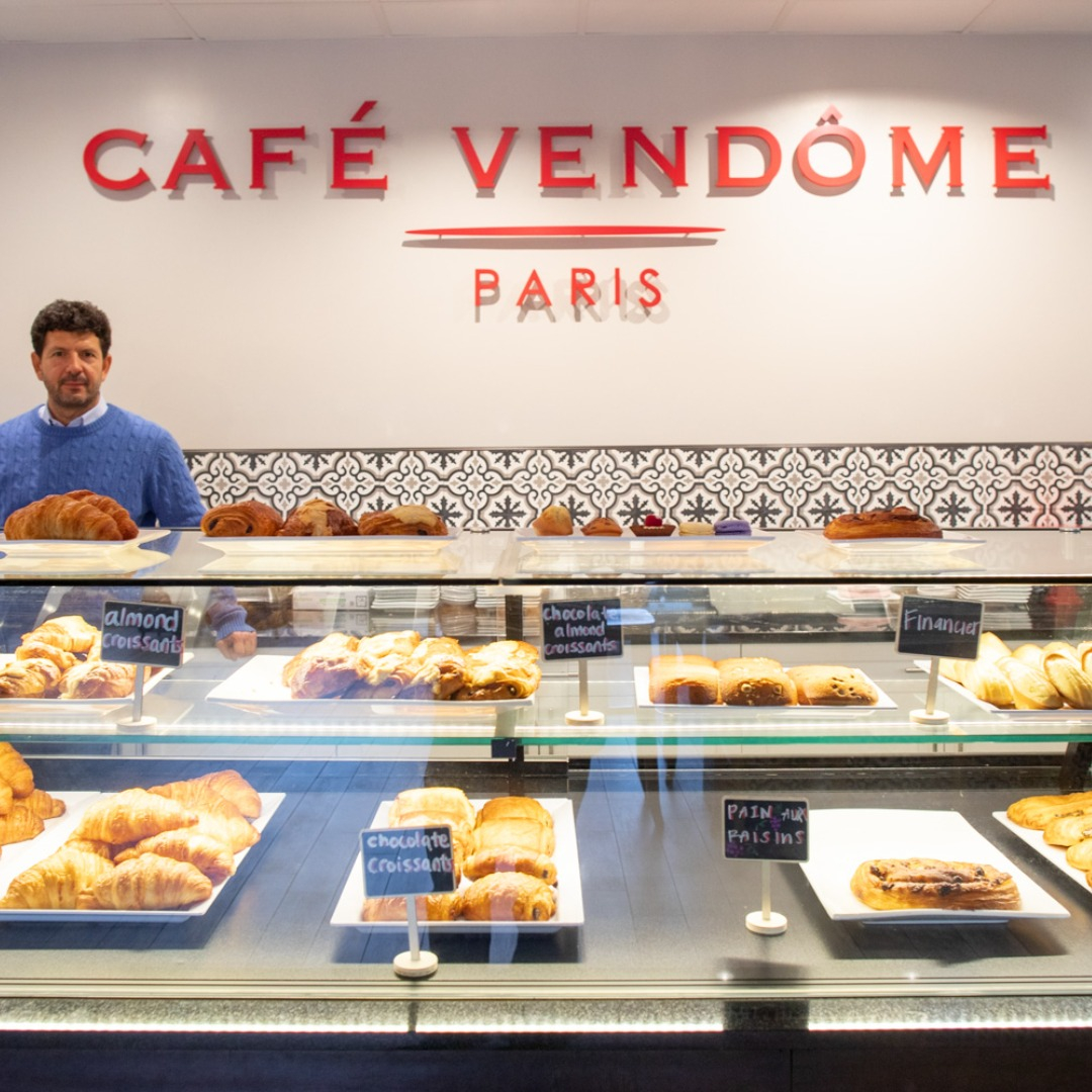 Café Vendôme in-store pastry counter-top, full of chocolate and almond croissant